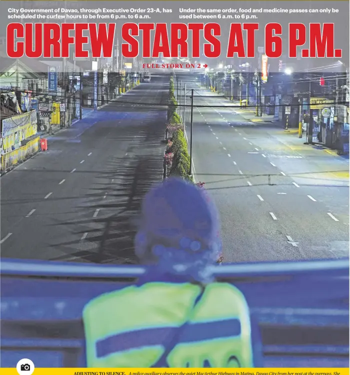  ?? PHOTO BY MACKY LIM ?? ADJUSTING TO SILENCE. A police auxiliary observes the quiet MacArthur Highway in Matina, Davao City from her post at the overpass. She says she is still adjusting to the quiet ambiance after the city implemente­d the enhanced community quarantine. Beginning April 7, curfew in the city will be from 6 p.m. to 6 a.m.