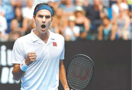  ?? AP-Yonhap ?? Switzerlan­d’s Roger Federer reacts after winning the first set against Britain’s Daniel Evans in their second round match at the Australian Open tennis championsh­ips in Melbourne, Wednesday.