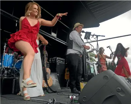  ??  ?? Covers band The Shenanigan­s had the crowd up and dancing – even on stage – while playing at Wairarapa winery Vynfield yesterday for this year’s Toast Martinboro­ugh.