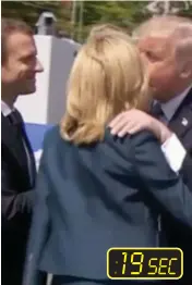  ??  ?? Clinch: He leans in to kiss Mrs Macron...