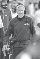  ?? ELAINE THOMPSON/AP ?? Mask-less Seattle coach Pete Carroll during Sunday’s win against New England.