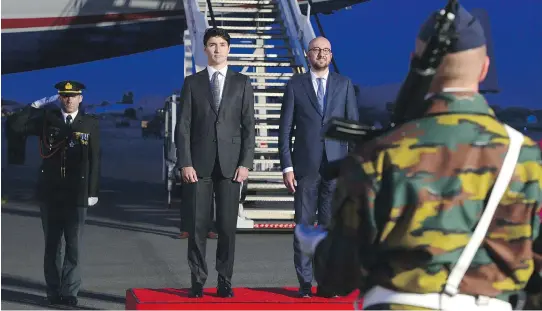  ?? SEAN KILPATRICK / THE CANADIAN PRESS ?? Prime Minister Justin Trudeau stands with Belgian Prime Minister Charles Michel as he arrives in Brussels on Wednesday to attend a NATO summit.