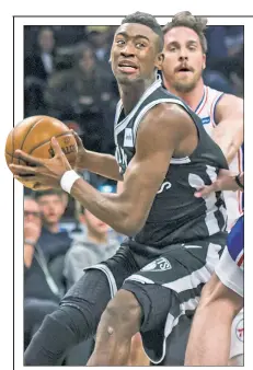  ?? Paul J. Bereswill ?? MESSAGE RECEIVED:
After allowing T.J. McConnell of the 76ers to score on a tip-in, Caris LeVert was chewed out by coach Kenny Atkinson. “I missed a box out, so it was very deserving,” LeVert said.