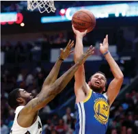  ?? AFP ?? Golden State Warriors guard Stephen Curry (30) shoots over New Orleans Pelicans guard E’Twaun Moore. —