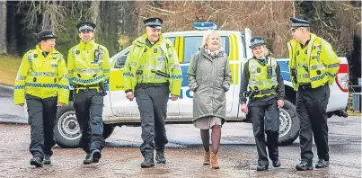  ??  ?? Roseanna Cunningham with PC Blair Wilkie, PC Daniel Sutherland, Special Constable Mike Flaherty, Special Constable Cheryl Black and PC Doug Darling at Blair Castle Estate.