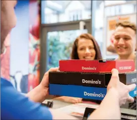  ??  ?? Domino’s effect: Pizza franchiser DP Poland’s stock rose as it opened a 50th store