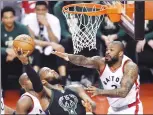  ?? Canadian Press photo ?? Milwaukee Bucks centre Greg Monroe (15) drives to the net for a basket over Toronto Raptors forward P.J. Tucker (2) during the first half of game five of an NBA first-round playoff series basketball game in Toronto on April 24.