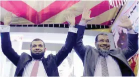  ??  ?? ALEXANDRIA: In this Oct 14, 2015 photo, Amr Mekky (left) and Ashraf Thabet, parliament­ary candidates of the Al-Nour Party, greet their supporters during a campaign rally in this city, a stronghold of the ultraconse­rvative Salafis. — AP