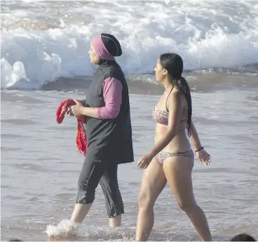  ?? FADEL SENNA / AFP / GETTY IMAGES ?? Socialist Prime Minister Manuel Valls has described the burkini as a “symbol of the enslavemen­t of women” unacceptab­le under France’s secular constituti­on.