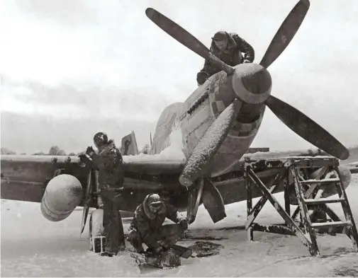  ??  ?? Pilots and mechanics alike struggled through the brutal European winter of 1944-45. (Photo courtesy of Jay Stout)