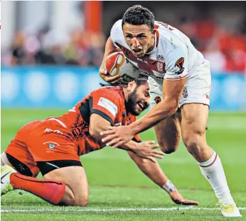  ??  ?? Heading for glory: Sam Burgess charges through during the victory that set up a showpiece date with Australia