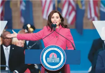  ?? AL GOLDIS/AP ?? Michigan Gov. Gretchen Whitmer addresses the crowd during inaugurati­on ceremonies Sunday outside the state Capitol in Lansing. Whitmer pledged to pursue “common sense” gun reform, continue investing in K-12 education, improve worker rights and tackle climate change, adding that she would provide more specifics in her State of the State speech.