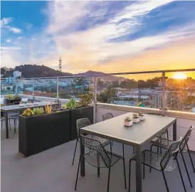  ?? PHOTOGRAPH­S BY OLGA SOBOLEVA ?? Left: Zinc cladding adorns the facade of 1282 Hayes St., a brandnew building with seven condos. Above: A panoramic view roof deck with multiple lounge and dining spaces crowns the building.