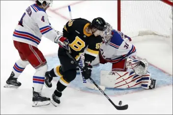  ?? MICHAEL DWYER — THE ASSOCIATED PRESS ?? New Bruins forward Tyler Bertuzzi, shown trying to get off a shot against the Rangers during a recent game, will play his former team, Detroit, in back-to-back games. (Boston.