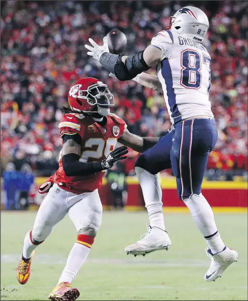  ?? Patroits’ Rob Gronkowski makes a game-changing catch in the fourth quarter in front of the Chiefs’ Eric Berry. — GETTY IMAGES. ??