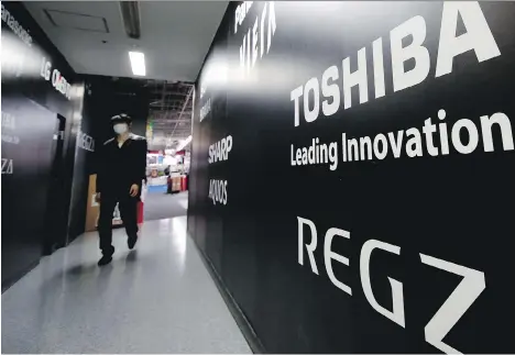  ?? SHIZUO KAMBAYASHI/AP ?? Toshiba has recently vowed not to take on new nuclear projects and called its strategy based on its U.S. nuclear unit Westinghou­se a mistake. It posted a 950 billion yen (US$8.4 billion) net loss, about double the 460 billion yen (US$4.1 billion) it...