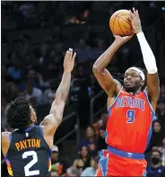  ?? ROSS D. FRANKLIN — THE ASSOCIATED PRESS ?? Detroit Pistons forward Jerami Grant (9) shoots over Phoenix Suns guard Elfrid Payton (2) during the first half of Thursday’s game in Phoenix.