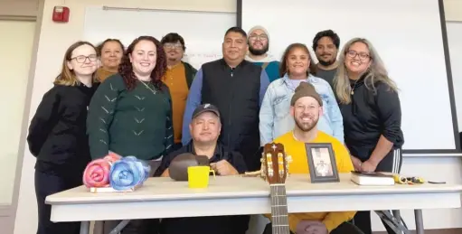  ?? PROVIDED ?? Ruben Olivares (standing at center) and his team at Northwest Center. He was shot in January, days before his family was set to move from Humboldt Park.