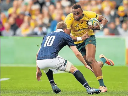  ?? Picture: GETTY IMAGES ?? STRONG CHALLENGE: Eto Nabuli of the Wallabies runs the ball during their Test against Scotland on Saturday in Sydney. Scotland held on for a famous 24-19 victory