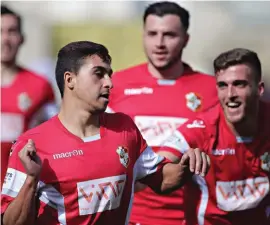  ??  ?? Yuri De Jesus Messias of Naxxar Lions (L) celebrates his way after scoring the first against Zebbug Rangers. Photo: Domenic Aquilina