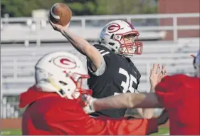  ?? Hans Pennink / Special to the times union ?? Guilderlan­d’s michael Gitto, a defensive end and center during his Pop Warner days, first tried out for quarterbac­k when he was in middle school.