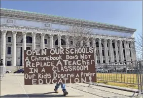  ?? Will Waldron / Times Union ?? Parents gather in West Capitol Park Monday urging lawmakers to go with new CDC guidance on social distancing so schools can reopen.