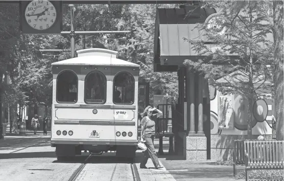  ??  ?? A trolley bus travels north on S. Main St. on Main Street Mall. The Main Street Trolley is set to return on April 30, just in time for the Memphis in May and Beale Street Music festivals. YALONDA M. JAMES/THE COMMERCIAL APPEAL FILE PHOTO