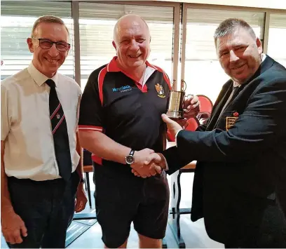  ?? ?? ● Derek Dyer, centre, receives his award from Martin Griffiths, left, and Gary Clare