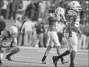  ??  ?? Texas’ Anthony Fera reacts to missing a 41-yard field goal try in a loss to West Virginia on Oct. 6. The kicking job has since returned to Nick Jordan, who mas made five of his last six tries.