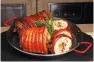  ??  ?? Rotisserie roasted pork belly “bagnet style”