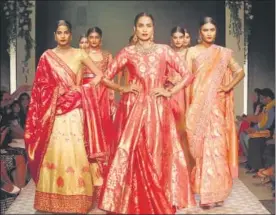  ??  ?? Brides, take your pick from lehenga-cholis, saris and jacket lehengas for your wedding celebratio­ns