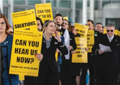  ?? PAT NABONG/SUN-TIMES ?? Amanda Steinbrunn, a United Airlines flight attendant, leads a demonstrat­ion Tuesday outside the departure area of O’Hare Airport’s Terminal 1.