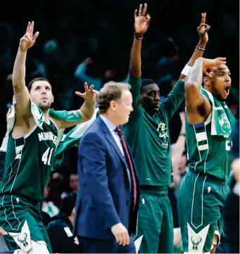  ?? (AP PHOTO) ?? THE MILWAUKEE BUCKS' bench reacts to a three-point basket during the second half of Game 4 of a second round NBA basketball playoff series against the Boston Celtics in Boston.