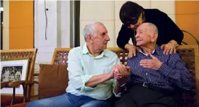  ?? Associated Press ?? Israeli Holocaust survivor Eliahu Pietruszka, right, speaks with Alexandre Pietruszka on Thursday as they meet for the first time in the central Israeli city of Kfar Saba. Pietruszka, who fled Poland at the beginning of World War II and thought his...