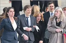  ?? Olivier Douliery Abaca Press ?? THE OWNER of Masterpiec­e Cakeshop, Jack Phillips, second from left, cited his Christian beliefs in declining to make the couple a wedding cake in 2012.