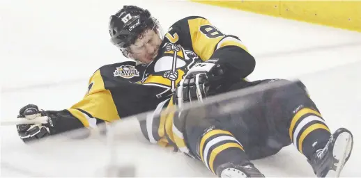  ?? – Archives ?? Sidney Crosby réagit à un coup à la tête, en 2017.