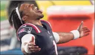  ?? Elise Amendola / Associated Press ?? Patriots quarterbac­k Cam Newton celebrates in the rain after beating the Ravens on Sunday.