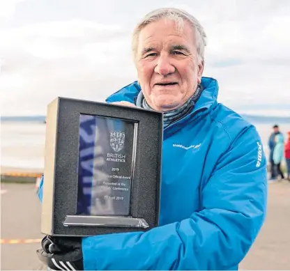  ??  ?? Ron Morrison with his UK Athletics Endurance Coach of the Year award.