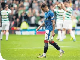  ??  ?? James Tavernier trudges from the pitch after losing again to Celtic earlier in the season