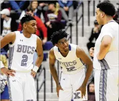  ?? MARC PENDLETON / STAFF ?? Samari Curtis (center) and Xenia teammates Meechi Harris (left) and Norde’ Uloho take a breather during their Flyin’ to the Hoop victory over Olentangy Liberty at Fairmont’s Trent Arena.