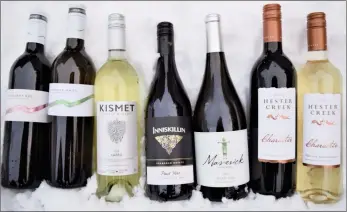  ?? Special to The Daily Courier ?? STEVE MacNAULL/
These seven wines will help you stick to your January budget. From left, Mount Boucherie 2017 Mandaray Red ($20), Mount Boucherie 2019 Mandaray White ($18), Kismet 2019 Safed ($19.50), Inniskilli­n Pinot Noir 2019 ($18), Maverick Pinot Gris 2019 ($20), Hester Creek 2019 Character Red ($19) and Hester Creek 2019 Character White ($16).
