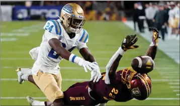  ?? ROSS D. FRANKLIN — THE ASSOCIATED PRESS ?? UCLA defensive back Jaylin Davies breaks up a pass intended for Arizona State’s Bryan Thompson earlier this month.