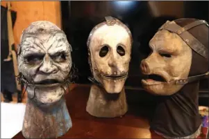  ?? The Sentinel-Record/Richard Rasmussen ?? CREEPY FACES: Some of Tony Buck’s completed mask designs are displayed at his Hot Springs area studio.