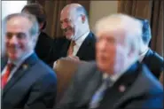  ?? EVAN VUCCI — THE ASSOCIATED PRESS ?? Outgoing White House chief economic adviser Gary Cohn laughs as President Donald Trump talks about him during a cabinet meeting at the White House, Thursday in Washington.