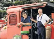  ??  ?? READY TO ROLL: Fireman Gary Ruddy, left, and driver Hennie van Rooyen put the gleaming Nelson Mandela Bay Steam Train through its paces on its maiden voyage yesterday