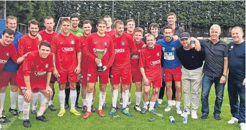  ??  ?? The Lochee United squad celebrate winning the Abbeyford Cup at St Andrews last week. Tomorrow they are nearer home with an away trip against North End.