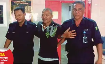  ??  ?? ANGGOTA polis mengiringi Badrul Hisham di Mahkamah Sesyen, Kuala Terengganu, semalam.