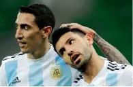  ?? — AP ?? Argentina’s Angel Di Maria (left) hugs Sergio Aguero after the latter scored a goal against Nigeria.