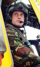  ?? ?? Royal pilot: Prince William at the controls of a rescue helicopter