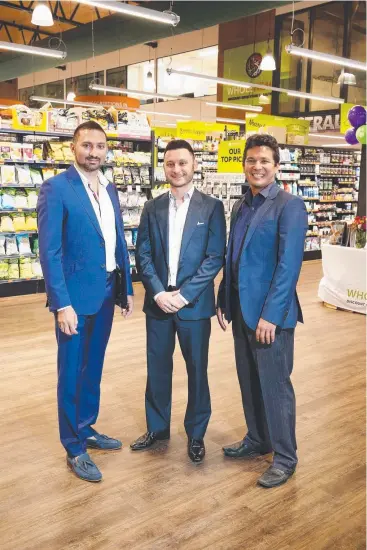  ?? Picture: BRENDAN RADKE ?? MEETING DEMAND: (From left) Brothers Frank and Vincent Pappalardo with Wholehealt­h Discount Drug Store and Health Foods owner Jason Christophe­r.